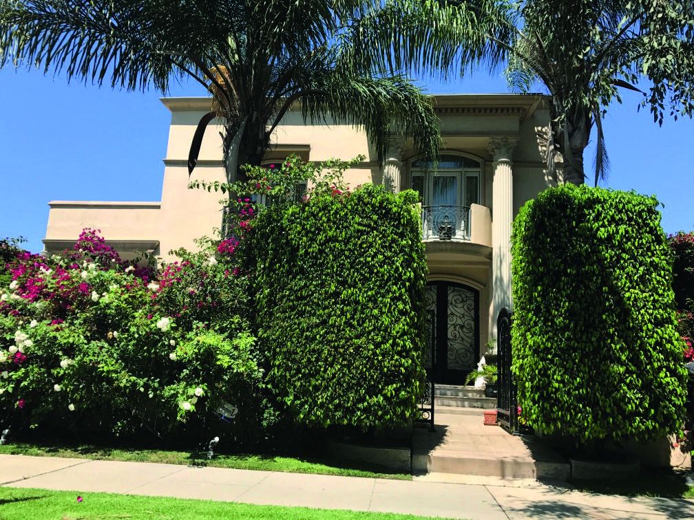 Two-story custom home with mature landscaping