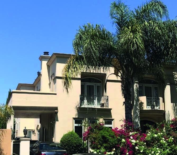 Custom home exterior with palms